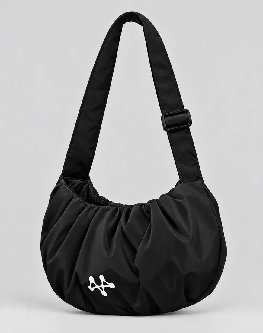 The Active Shoulder Bag worn over the shoulder