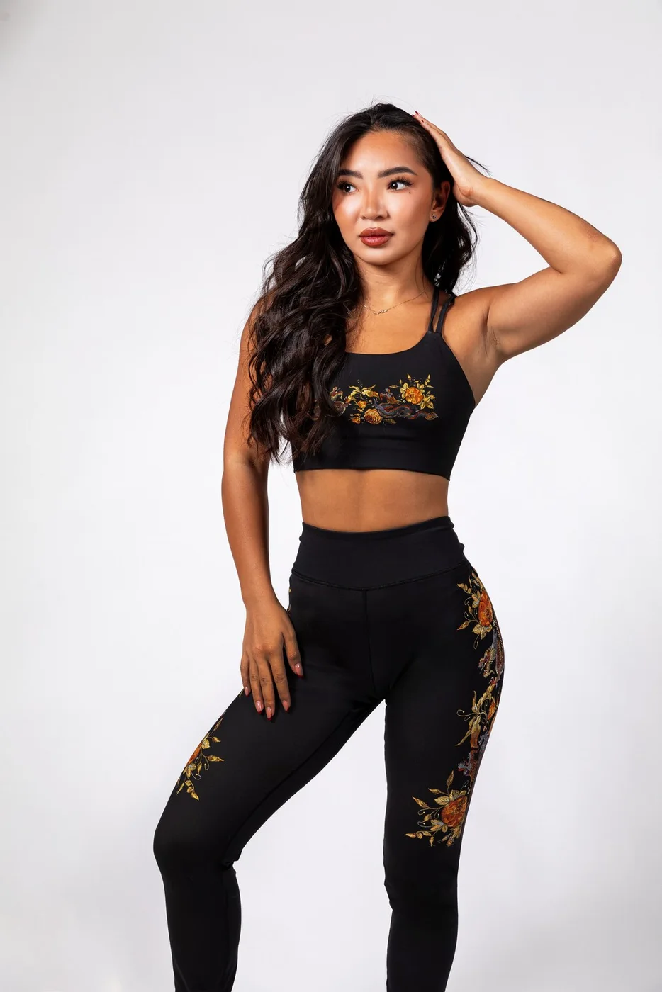 Model wearing The Signature Sports Bra and Legging in the Starflower print